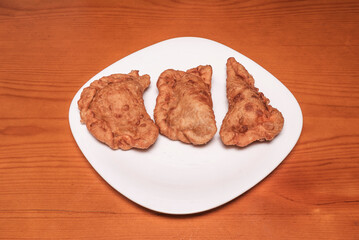Beef and vegetable empanadas, homemade pastry, served with homemade tomato sauce