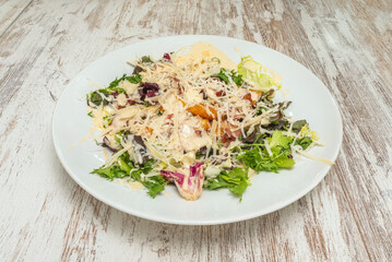 chicken salad with roasted vegetables such as bell peppers and zucchini, all brought together by a light Provençal herb vinaigrette