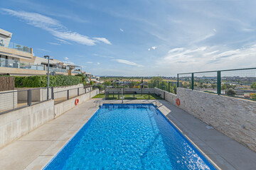 Balinese-inspired water area with wooden pergolas and tropical vegetation