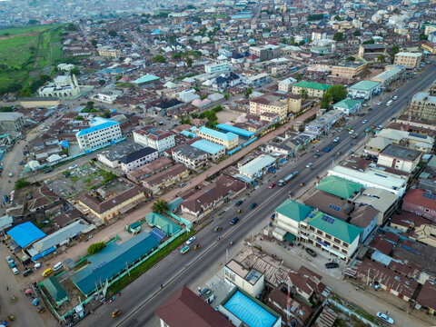Aerial view of the bustling Ahmadu Bello Way lined with buildings and traffic, a vibrant city scene unfolds, Kaduna, Kaduna, Nigeria.