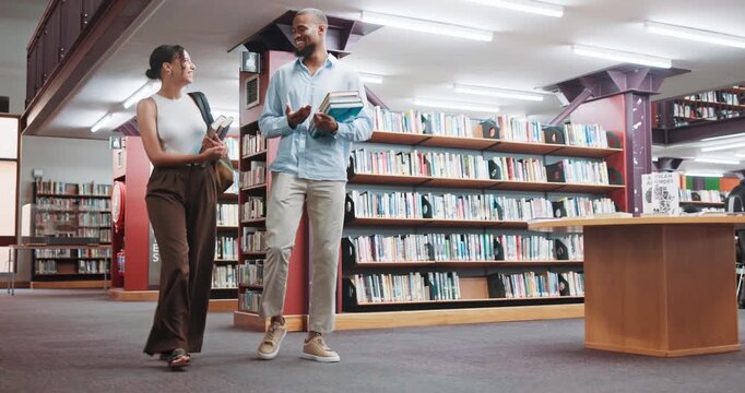 College students, friends and walking with books in library for test study, research or education. Learning, gen z people and talking on campus for thesis information, exam preparation or scholarship