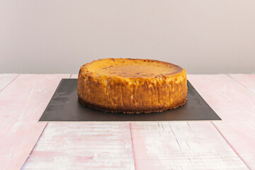 Lemon ricotta cheesecake, lighter and grainier than the cream cheese version typical of Italian cuisine, with a lemon glaze