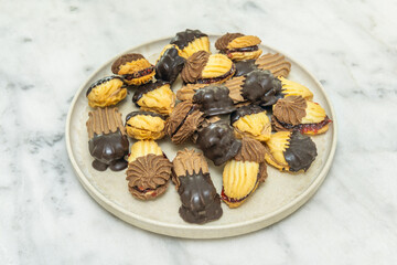 Modern tea pastries with shortbread decorated with royal icing in contemporary floral and geometric designs