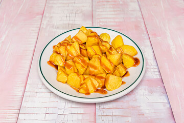 Classic fries served in a small metal bucket with three optional dipping sauces