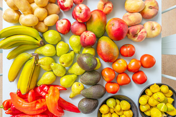Farmers market scene with natural produce displaying its organic shapes on a matte and luminous pastel blue surface