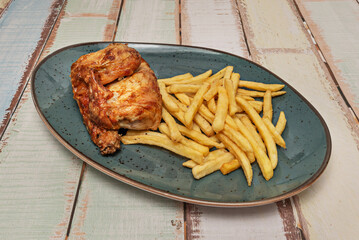 Glazed grilled chicken with teriyaki sauce, presented with waffle fries and toasted sesame seeds