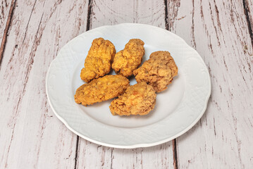 Fried chicken wings with a touch of cayenne pepper for a light heat, perfect for pairing with a cold beer