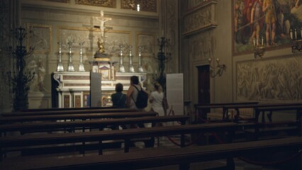 Blurred church interior showing defocused ornate altar and wooden pews with shallow bokeh for soft depth; background backplate copyspace calm.