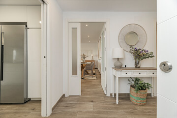 Bright entryway with a large side window that allows direct natural light to flow into the...