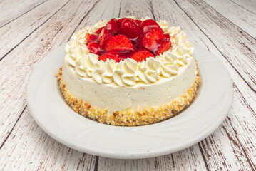 Strawberry and Cream Tart: Fresh strawberries on a milk meringue and fluffy almond sponge cake