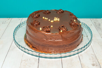 Chocolate and strawberry cake with layers of light mascarpone cream and white chocolate shavings