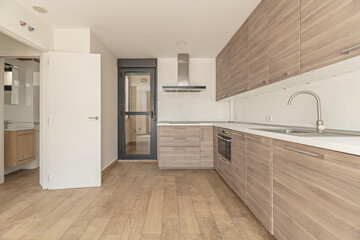 Minimalist kitchen with pearl gray cabinets, matte black accents, and premium appliances
