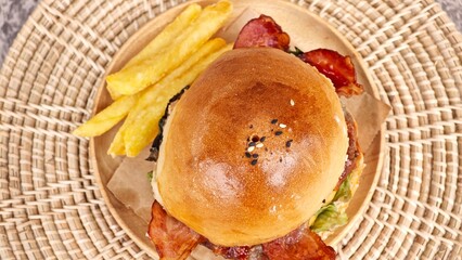 BBQ pork burger with cheese and bacon.