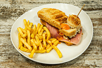 Sweet loin sandwich with grated natural tomato and extra virgin olive oil on freshly toasted rustic glass bread