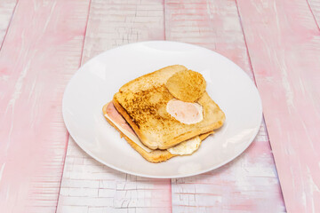 Classic cucumber sandwich with thinly sliced ​​cucumber, butter, and fresh mint on white bread