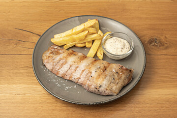 Strips of Iberian pork tenderloin sautéed with soy sauce, ginger, and garlic, accompanied by basmati rice and freshly chopped chives