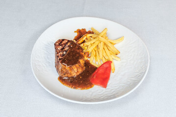 28-day aged grilled beef tenderloin, succulent to perfection, with a red wine reduction and grilled wild asparagus
