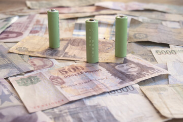 invest clean power concept with green batteries and global money