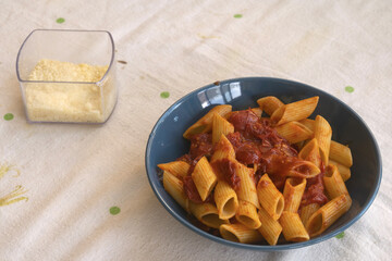 penne pasta with fresh cherry tomato sauce and parmesan cheese