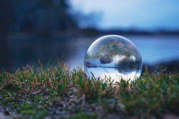 Close up of a crystal ball at a lake