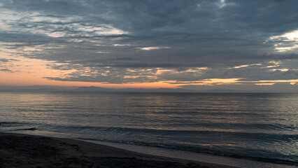 Dawn with dramatic clouds over the Aegean Sea
