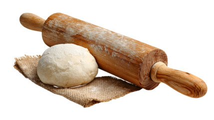 Rustic wooden rolling pin with ball of dough on textured surface