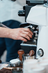 Barista brewing coffee close-up