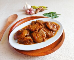 Rendang Jengkol, dogfruit simmered in spices and coconut milk. Indonesian traditional comfort food, with a spicy savory taste typical of rendang and a legit jengkol texture.