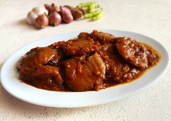 Rendang Jengkol, dogfruit simmered in spices and coconut milk. Indonesian traditional comfort food, with a spicy savory taste typical of rendang and a legit jengkol texture.