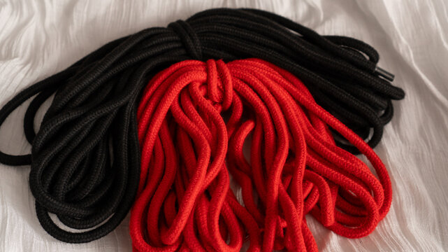 Red and red shibari rope. Adult toys