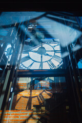 Mesmerizing view of clock tower with intricate shadows and reflections creating captivating visual...