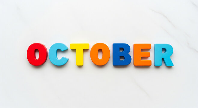 Vibrant wooden letters spelling october isolated on white background, presenting a cheerful visual for calendar, educational, or seasonal concepts
