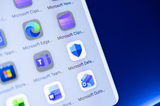 Poznan, Poland - October 16, 2025: Microsoft Edge and Defender applications on smartphone screen, highlighting digital security, productivity tools