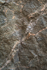 Natural dark stone texture close-up surface background with rough texture