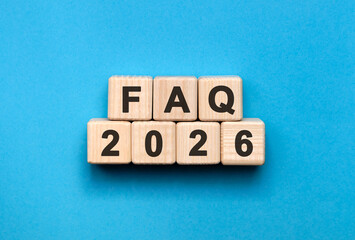 FAQ New year 2026 concept. Wooden cubes on a blue background