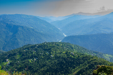 Naklejka premium View of Himalayan mountain and forest from Tarey Bhir point, tourist spot, Sikkim, India. 'Bhir' means cliff in the local Nepal language,about 10,000 feet long path, a breathtaking view at the edge.