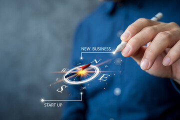 New business direction and startup strategy concept with compass and innovation idea guiding success path © jittawit.21
