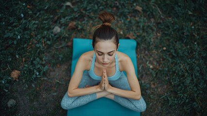 Young Woman Practicing Mindful Yoga Breathing Outdoors in Calming Blue Green Light