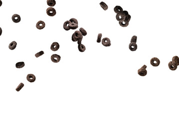 Chocolate rings cereal spill out into a bowl. Breakfast.