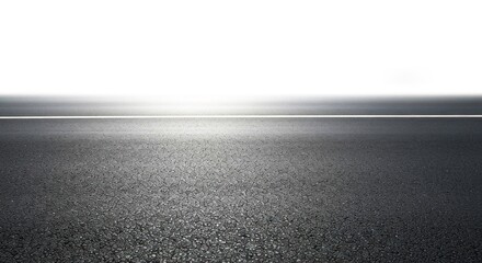Empty asphalt road stretching into a bright white horizon