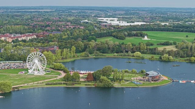 Aerial view of  a green space called Willen Lake and ferris wheel, Milton Keynes, Buckinghamshire, England