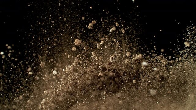 Super Slow Motion Shot of Exploding Soil with Rocks Camera at 1000fps.