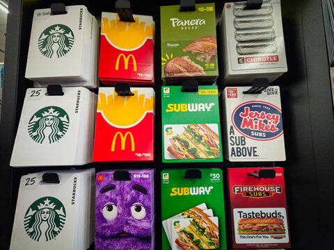 Gift cards on display from popular food chains including Starbucks, McDonald's, Panera Bread, Chipotle, Subway, Jersey Mike's Subs, and Firehouse Subs on October 21, 2025.