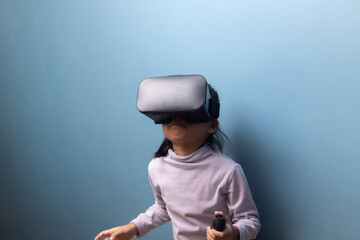 Young girl using virtual reality headset exploring immersive digital world, concept of metaverse, VR learning, and future education technology for children.