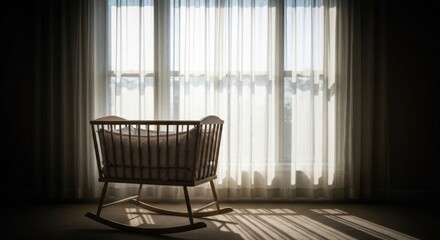 Wood crib in sunlit room with sheer curtains
