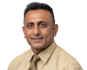 Happy smiling Indian businessman in professional corporate headshot. This confident middle aged man looking at camera creates friendly and successful portrait