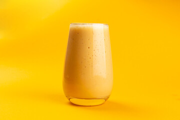 Smoothie on a yellow background.