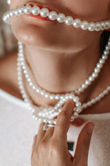 Chic elegant fashion accessories details of white pearl beads and woman's lips