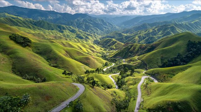 Ultra HD Winding road through the lush green hills of bukidnon aerial video, mountain road drone video, hill road drone video