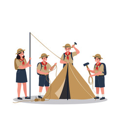 teacher and students setting up a camping tent together. 